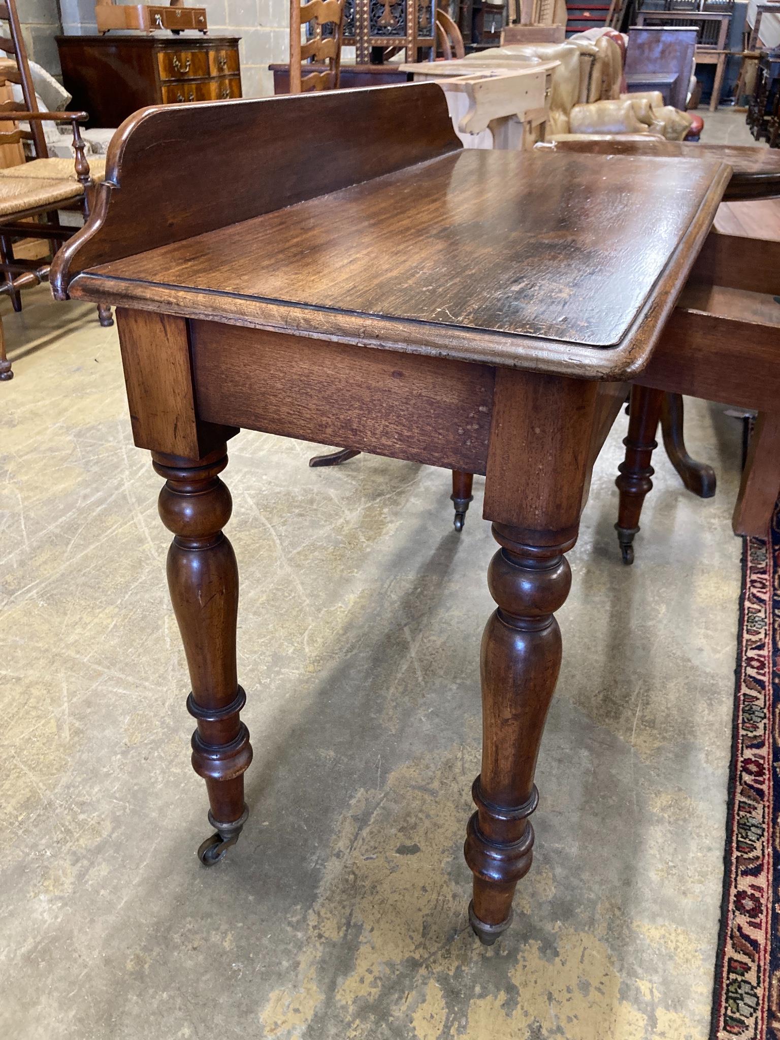 A Victorian mahogany writing table